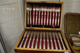 A cased set of twelve fish knives and forks with plated handles, another cased set of fish knives