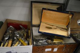A quantity of cutlery to include a cased Continental silver set of knife, fork and spoon.