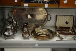 A large plated twin handle tray four piece tea and coffee service and other plated items.