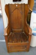 A 19th century oak lambing chair.