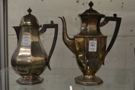A silver coffee pot and matching hot water jug.