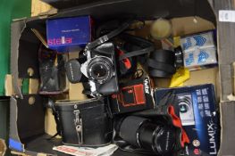 A Pentax camera and other related items.