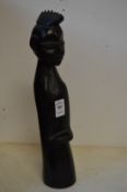 A stylised carved wood tribal figure.