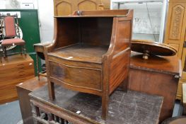 A mahogany bedside cabinet.