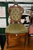A good small Victorian carved walnut and upholstered occasional chair.