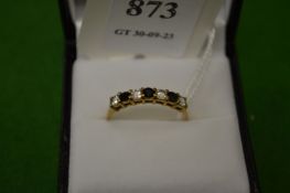 A 9ct gold, diamond and sapphire seven stone ring, size R½.