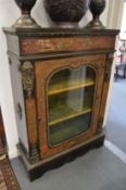 A 19th century Boulle single door pier cabinet.
