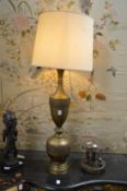 A large decorative brass standard lamp.