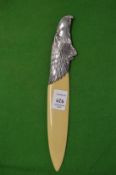 A letter opener, the silver handle modelled as an eagle head.