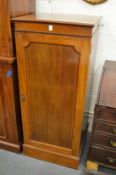 An Edwardian mahogany pedestal cupboard.