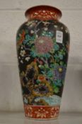 A Chinese famille noire vase.