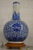 Chinese blue and white bottle vase on stand.