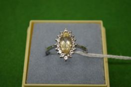 A decorative silver ring, size T½.