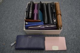 A Radley purse and various other purses.