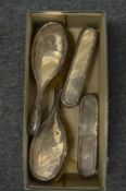 Two pairs of silver backed dressing table brushes.