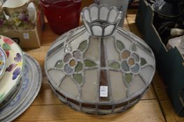 A stained glass and leaded ceiling shade.