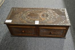 An Anglo Indian carved wood two drawer table top chest.