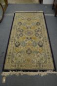 A modern machine made Persian style rug, 200cm x 100cm.