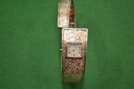 A Ladies Janus bangle style wristwatch.