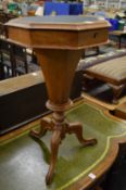 A Victorian walnut octagonal shaped work table.