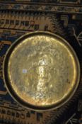 An Eastern circular engraved brass tray.
