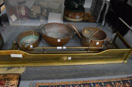 Two brass fenders and three copper items.