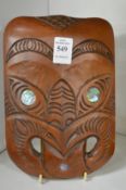 A Maori carved wood mask.