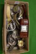 Various wristwatches and a leather cased travelling bedside clock.