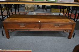 A Chinese hardwood two drawer rectangular low table.
