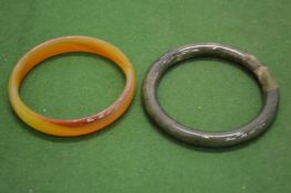 Two jade bangles.