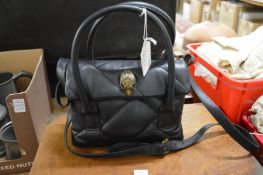 A Kurt Geiger handbag.