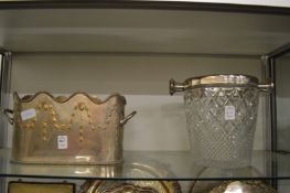 A plated bottle holder and an ice bucket.