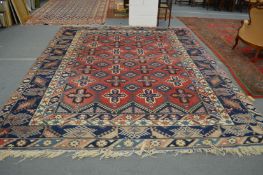 A good large Persian design carpet, red ground with stylised decoration, 375cm x 300cm.