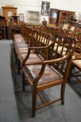 A set of eight Georgian style mahogany dining chairs, two with arms.