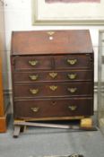 A George III mahogany bureau (faults).