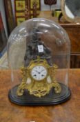 A 19th century French spelter and ormolu figural mantle clock housed under a glass dome.