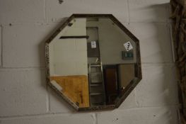 An octagonal shaped mirror.