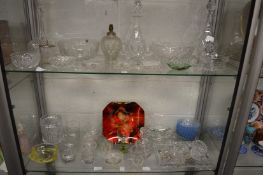 A collection of glassware to include decanters, bowls, table lamp etc.