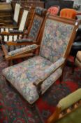 A Victorian walnut framed open armchair.