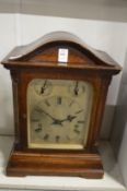 A large oak cased mantle clock.