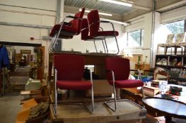 A set of six office chairs.