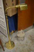 A brass floor standing lamp.