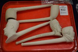 Three pictorial clay pipes and two others.