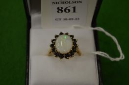 A 9ct gold, opal and gem set ring, size Q½.