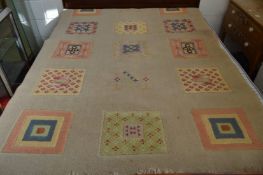 A modern cream ground rug with square shaped panels, 220cm x 148cm.
