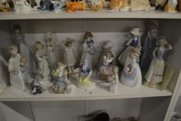 A group of Lladro, Nao and similar figures.
