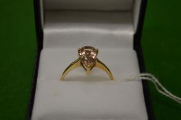 A 9ct gold ring, set with a pear shape stone, size R½.