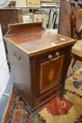 An Edwardian inlaid mahogany coal pedonium.