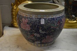 A large Chinese famille rose fish bowl (cracked).