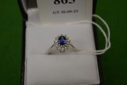 An 18ct white gold, diamond and tanzanite ring, size M.